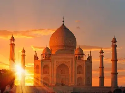 The Taj Mahal at sunrise, a renowned Indian monument, viewed during a car tour from Delhi to Agra